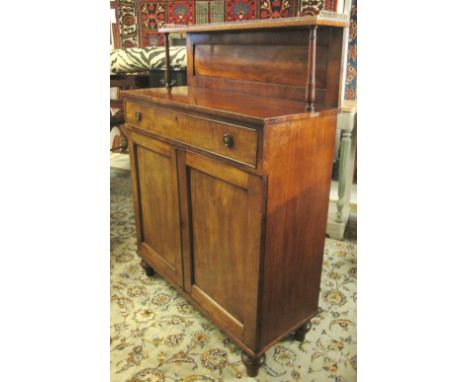 CHIFFONIER, Regency mahogany with a raised galleried shelf back over a frieze drawer and two panelled doors on short turned f