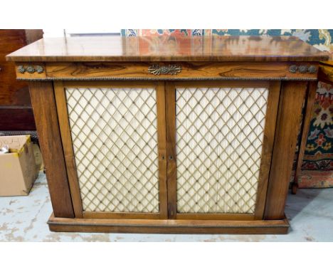 SIDE CABINET, Regency rosewood and brass mounted with a pair of trellis grille fronted and pleated panelled doors enclosing a