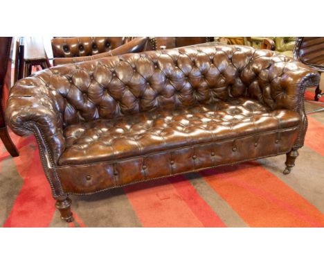 CHESTERFIELD SOFA, Victorian allover deep buttoned antique leaf brown grained hide leather and turned front supports, 168cm W