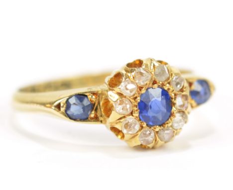 A late Victorian 18ct yellow gold diamond and sapphire cluster ring, hallmarked for Birmingham 1899, size L 1/2, approx 2.7g.