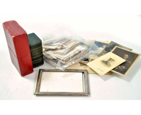 A collection of Victorian and Edwardian portrait photographs in various sizes, some contained in two leather book shaped boxe