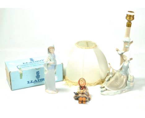 LLADRO; a figural table lamp base depicting a woman beside a tree with a dove, height 35cm including fitment, and a boxed fig