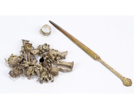 A substantial charm bracelet with charms including dog, boot, jug, elephant, bear, approx 174h, a silver ring and a silver le