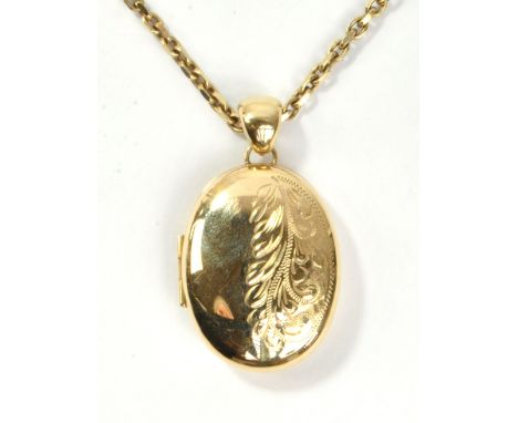 A 9ct yellow gold oval locket suspended on a 9ct belcher link chain, length 50cm, approx 21.9g.&nbsp;