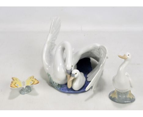 NAO; a boxed swan and signet figure group stamped 1358 to base, length approx 29cm, and two further smaller figures of a duck