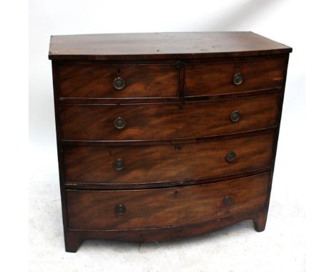 A Regency and later mahogany and walnut bowfronted chest of two short over three long drawers raised on bracket feet, width 1