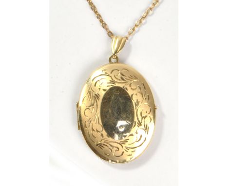 A 9ct yellow gold oval locket suspended on a yellow metal belcher link chain, length approx 44cm, approx 10.5g.