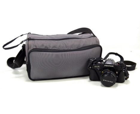 PENTAX; a 'Super A' camera, a zoom lens and a further lens, in fitted bag with manuals, etc.