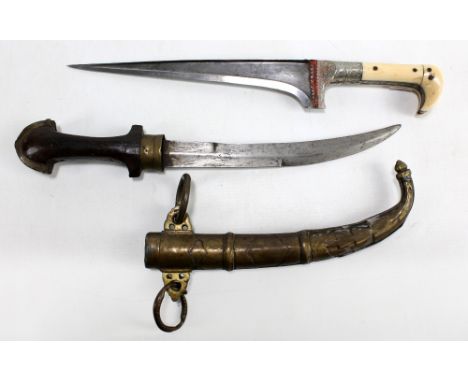 An Indian pesh-kabz dagger, the tapered blade with engraved detail to floral engraved white metal mounts and shaped ivory hil