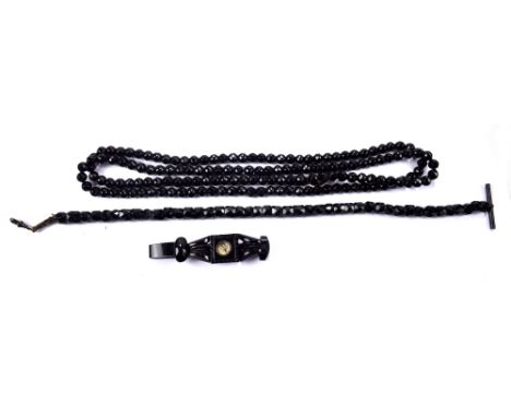 A black jet bead necklace, length 110cm, a fob chain with T-bar and a sectional bracelet centred with a compass (3).