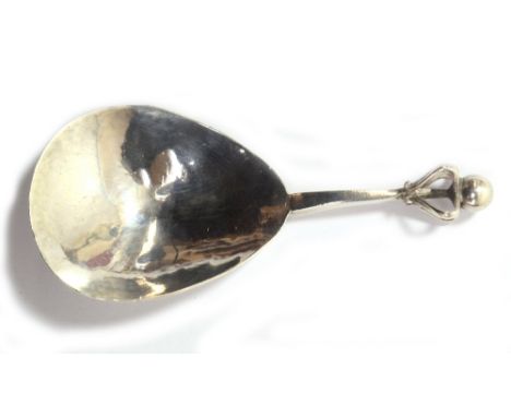 ALBERT EDWARD JONES; an Edward VII hallmarked silver caddy spoon with fig shaped hammered bowl and pierced terminal with ball