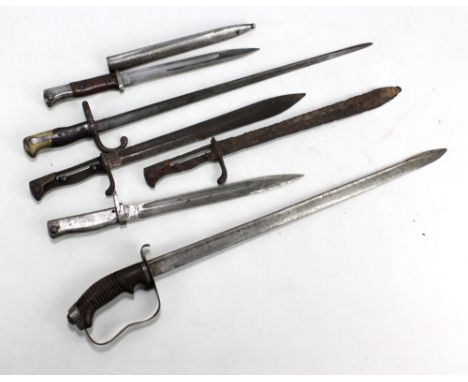 A group of bayonets including example of French manufacture with signature and date of 1878 to blade back, blade length 52cm,