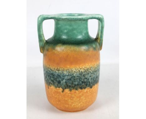 RUSKIN POTTERY; a twin handled vase with crystalline green and orange banded glaze, impressed mark and date 1933 to base, hei