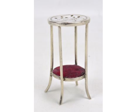 SAUNDERS &amp; SHEPHERD; an Edward VII hallmarked silver hat pin stand modelled as a circular two tiered occasional table/bar