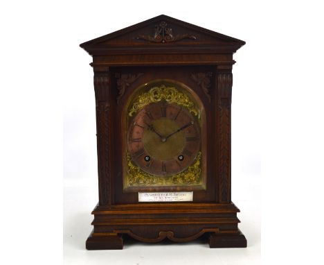 LENZKIRCH; a late 19th century German mahogany cased mantel clock of architectural form with carved foliate detail, the chapt