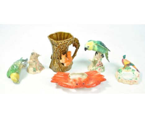 BESWICK; a dish surmounted with peacock and two parrots (one af), a Sylvac squirrel and oak tree jug and an ashtray modelled 