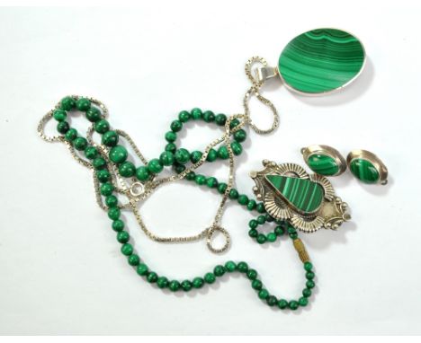 A small group of malachite jewellery to include a hallmarked silver mounted oval pendant, suspended on a silver box link chai