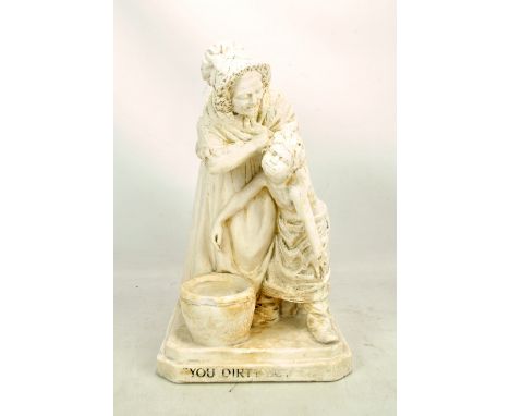 A plaster figure titled 'You Dirty Boy' modelled as a woman forcibly washing a boy, height 39.5cm (af).Additional Information