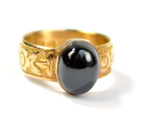 A Victorian 18ct yellow gold floral and foliate cast ring set with oval garnet cabochon, size M, hallmarked for Birmingham 18