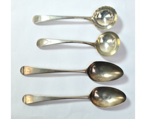 A near pair of George III hallmarked silver Old English pattern table spoons, one marked for Hester Bateman, London 1782, the