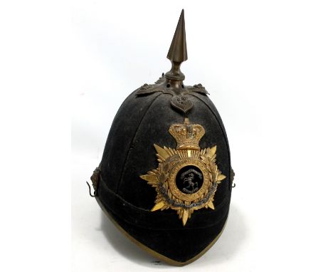 An officer's spiked helmet for the Royal West Kent Regiment with plate to front, twin rosette fittings to sides and chain lin