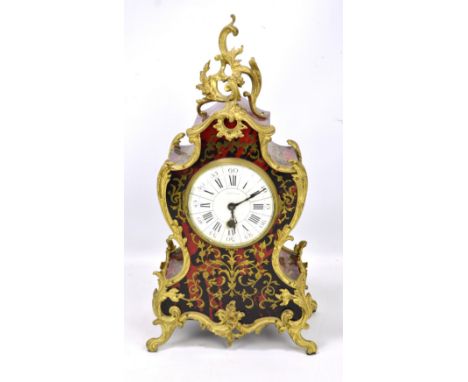 A late 19th century simulated Boulle work and gilt metal thirty hour mantel clock, the circular dial set with Roman numerals 