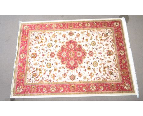 A beige ground Keshan carpet, 280 x 200cm.