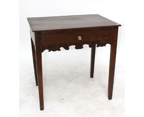 A George III oak side table with single frieze drawer and fretwork apron, raised on tapering square supports.