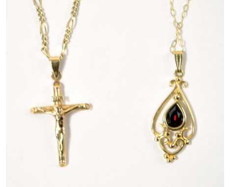 A 9ct yellow gold open framed pendant set with pear cut garnet, height 3cm including bail, suspended on gold fine open link c
