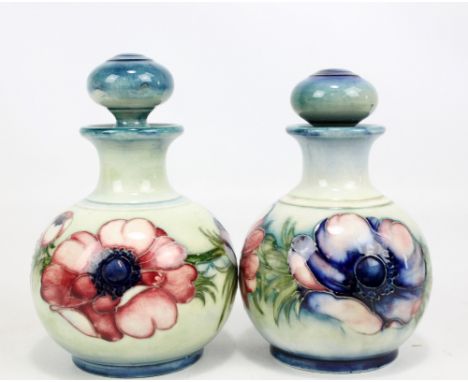 MOORCROFT; a pair of 'Anemone' pattern tubeline decorated globular scent bottles with stoppers, impressed marks and WM monogr