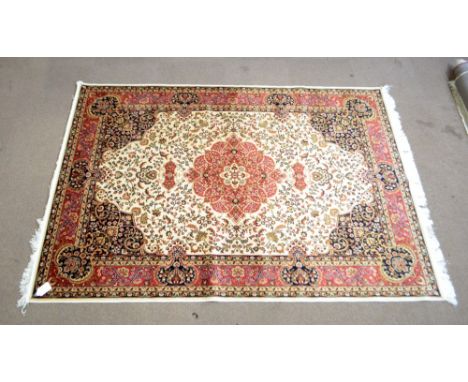 A beige ground Keshan carpet, 230 x 160cm.