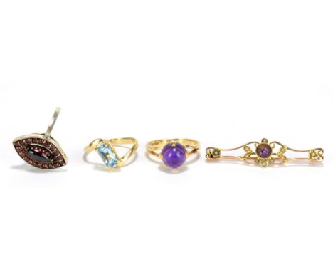 A 9ct yellow gold and amethyst cabochon set ring, size M, a further 9ct yellow gold dress ring, a silver garnet set dress rin