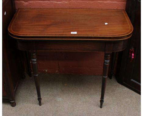 A 19th century mahogany card table with hinged double action top.