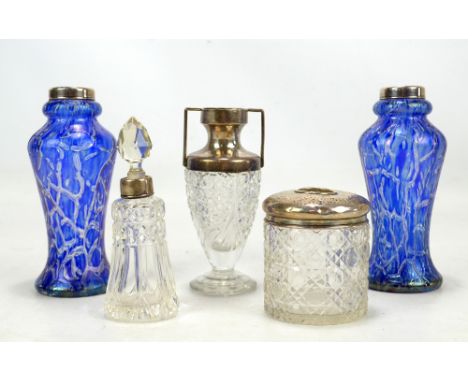 A pair of blue glass vases with iridescent finish and hallmarked silver rims, height 15.5cm, a cut glass silver topped vase, 