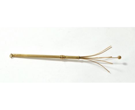 A 9ct yellow gold overall engine turned decorated hexagonal swizzle stick with suspension, Deakin &amp; Francis, Birmingham 1