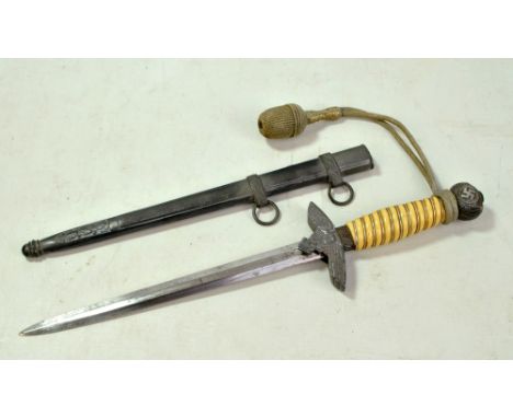 A replica Luftwaffe officer's dagger with blade stamped 'Solingen', ribbed grip and complete with scabbard, length 42.5cm.