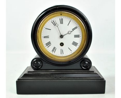 A late 19th century ebonised mantel clock, the white enamel dial set with Roman numerals, movement inscribed 2071, on stepped