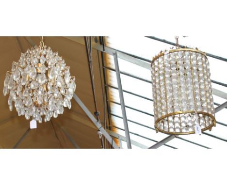 A gilt metal and glass prisms cylindrical ceiling lamp, height 36cm, and a similar globular six light chandelier (2).