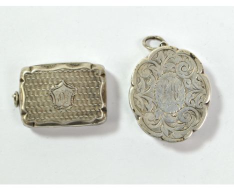 HILLIARD &amp; THOMASON; a Victorian hallmarked silver shaped oval vinaigrette overall engraved with foliate scrolls and cent