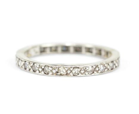 A white metal diamond set full eternity ring, size O, approx 2.7g.
