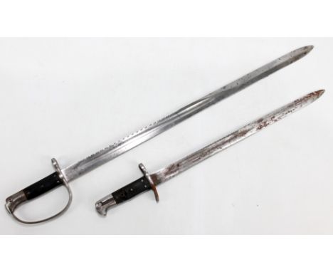 Two sawback bayonets, the larger example of military issue with broad arrow and further stamps, blade length 65.6cm, with fur