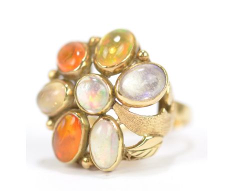 A 14ct yellow gold and crystal opal seven stone ring, size L, approx 7g.