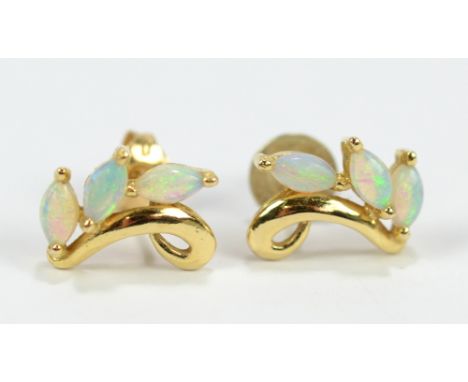 A pair of yellow metal and opal ear studs, approx 1.3cm, one with replaced butterfly&nbsp;back, approx 1.7g.