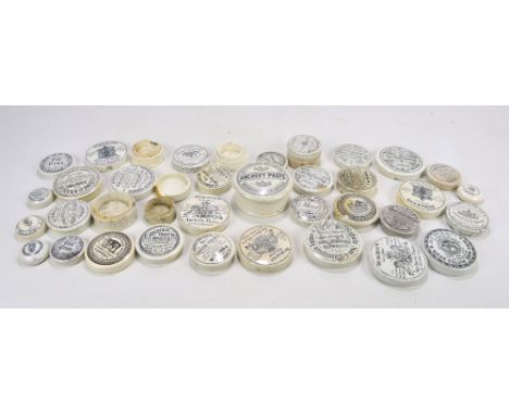 A collection of Victorian and Edwardian ceramic predominantly chemist pot lids to include W Woods of Plymouth, also Cherry To