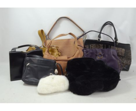 A group of various bags comprising a Calvin Klein beige crocodile embossed messenger bag with shoulder strap, a Nicoli beige 
