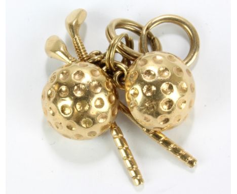 A pair of 14ct yellow gold cufflinks modelled as a half cut dimpled golf ball and golf club, inscribed 'To Jack with love, De