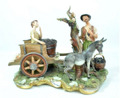 CAPODIMONTE; a large figure group, 'La Vendemmia', length approx 40cm.Additional InformationChips to foliage and fruit, donke