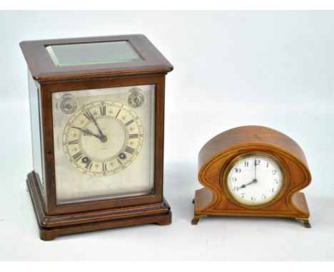 WINTERHALDER &amp; HOFMEIER; a mahogany cased bracket clock with bevelled glass panels, the silvered chapter ring set with Ro