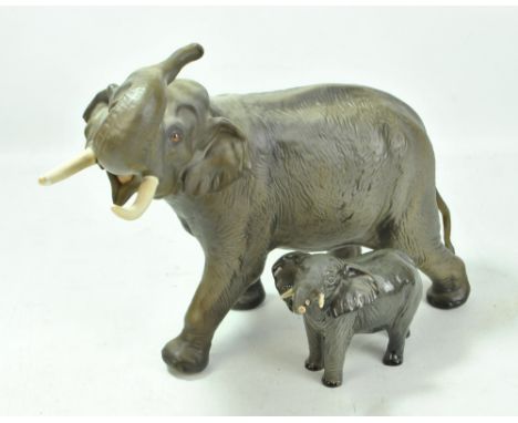 BESWICK; a large matte finish model of an elephant, length approx 42cm, and a small glazed example (2).Additional Information