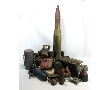 A mixed group of military equipment and related items including large ammunition shell, height 91cm, three gas masks includin